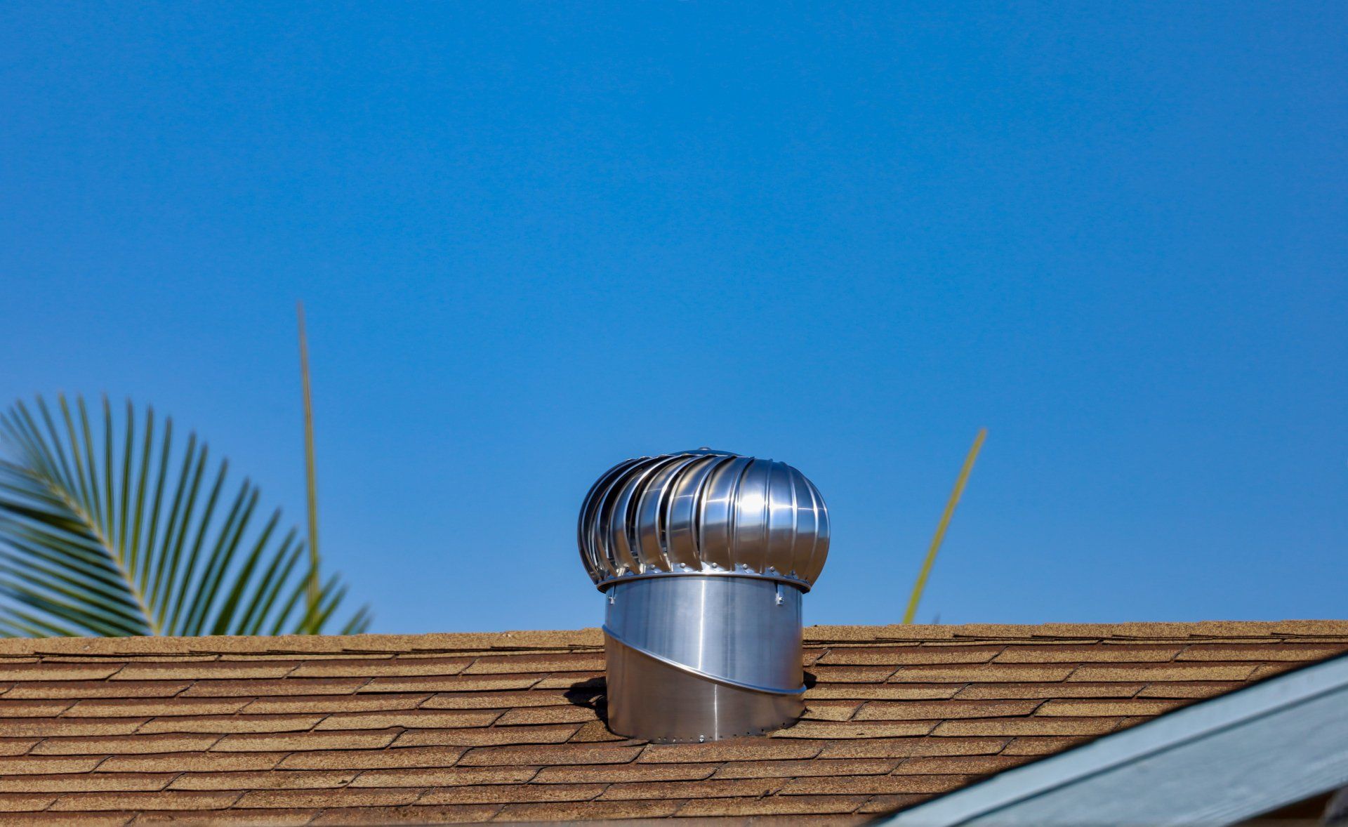 Whirlybirds On Brown House Roof — Roofing in Townsville, QLD Whirlybirds On Brown House Roof — Top Roof NQ in Townsville, QLD