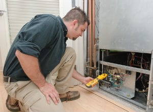 man checking hvac system