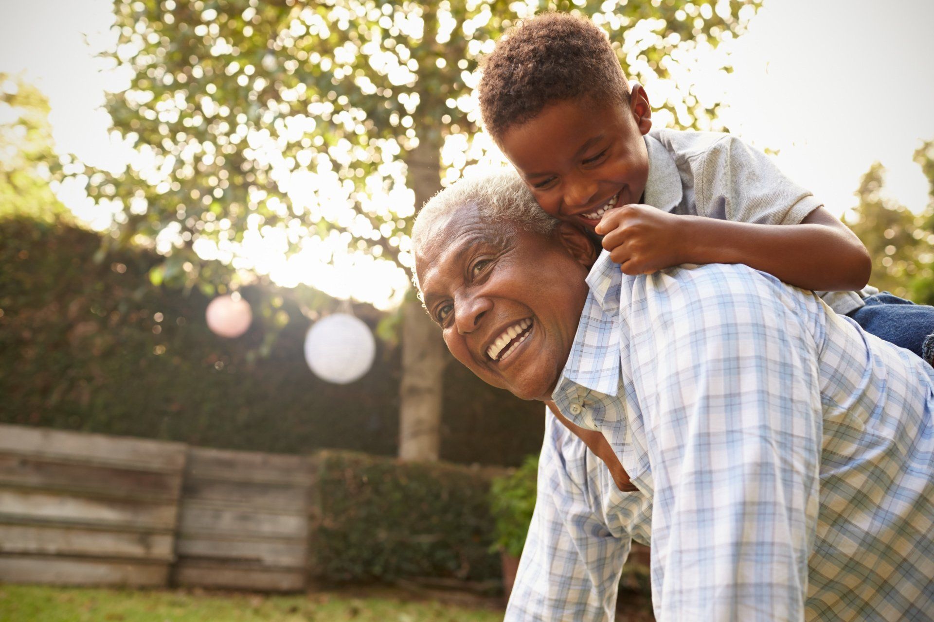 senior and grandchild playing