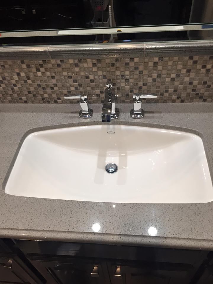 Plumber working on home drain system Tulare CA