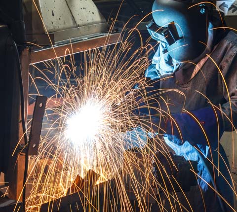 Custom Metal — Man in Welding Metal Bars In Williston, ND Custom Metal — Man in Welding Metal Bars In Williston, ND