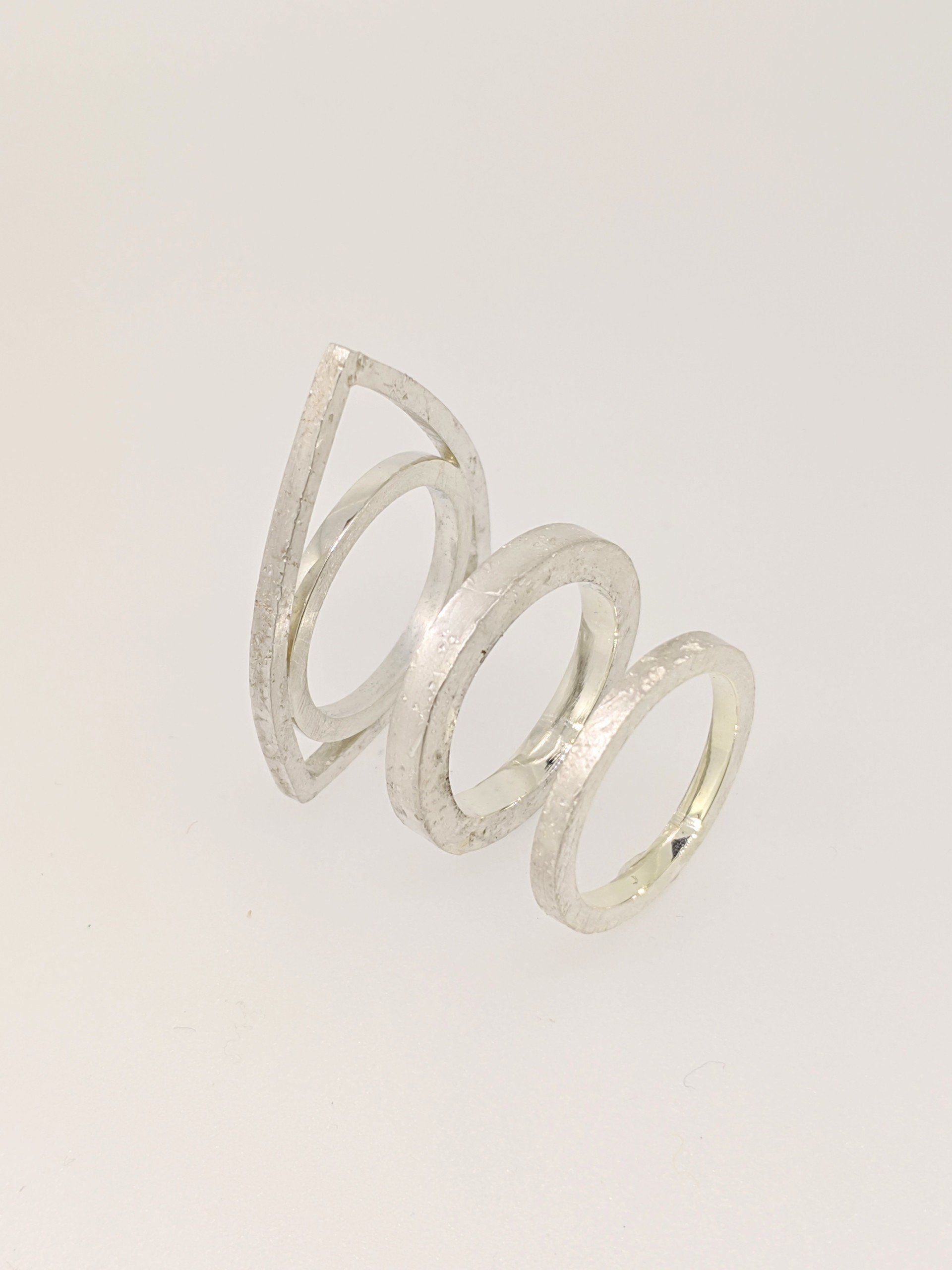 Architectural and sculptural textured rings in sterling silver