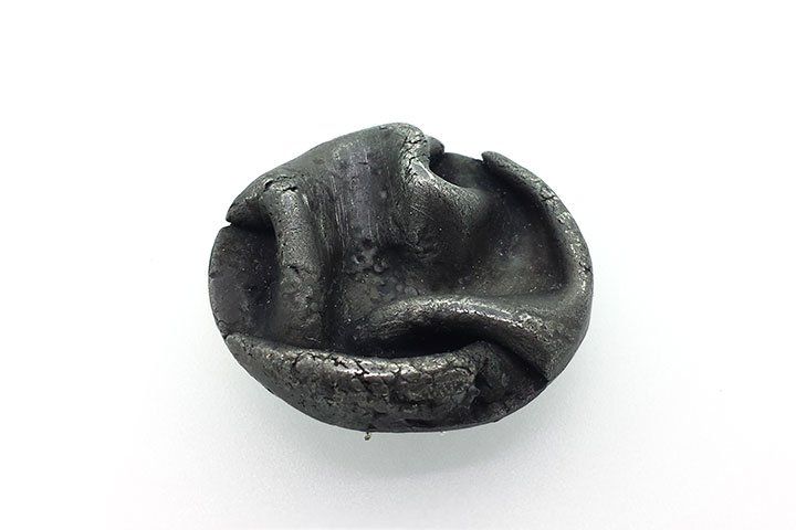 Textured/folded fine silver circular brooch with an oxidized finish
