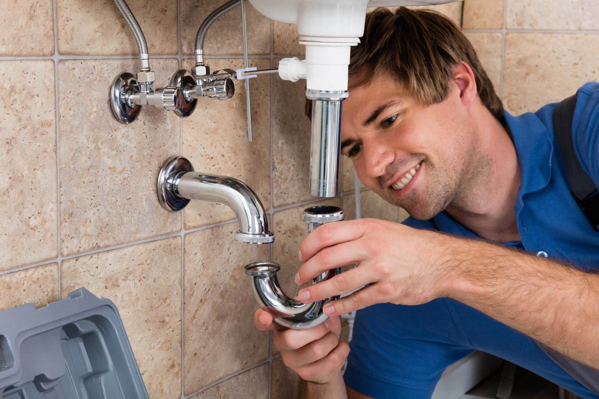 Plumber Fitting Sink Pipe — Clyde, MI — Countryside Plumbing