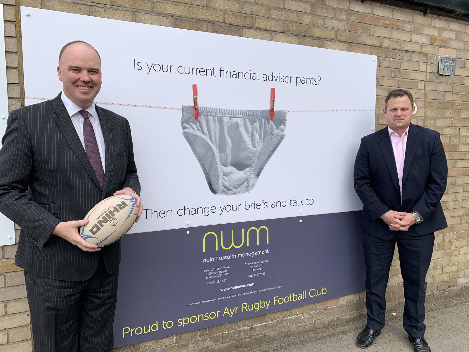 Gary pictures with Ayr Rugby C.O.O Glen Tippet next to NWM's sponsor's board Gary pictures with Ayr Rugby C.O.O Glen Tippet next to NWM's sponsor's board