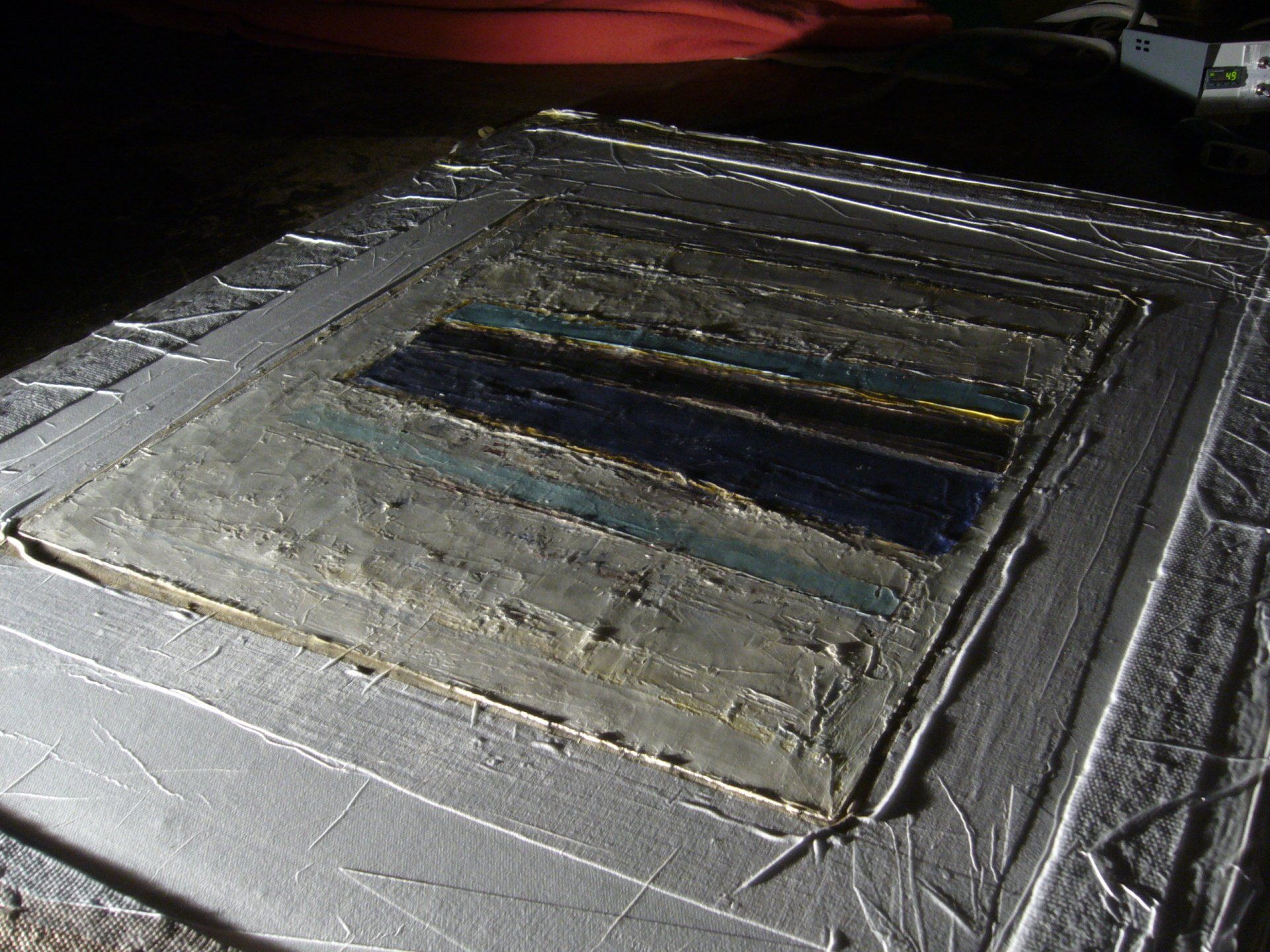 After surface treatment inside vacuum bag under raking light