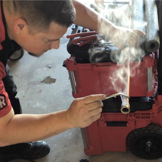 Plumber Holding Wrench — HomeRun Plumbing Heating and Cooling — Albuquerque, NM Plumber Holding Wrench — HomeRun Plumbing Heating and Cooling — Albuquerque, NM