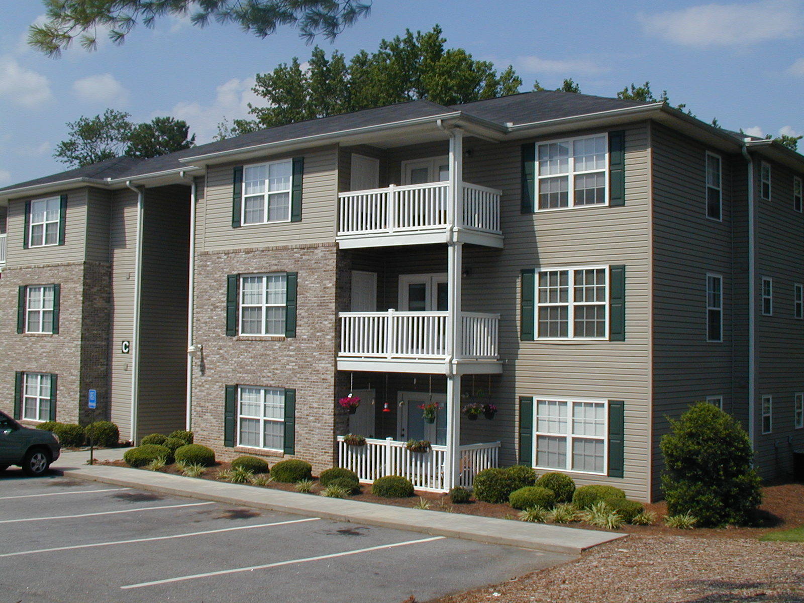 2 BR / 2 BTH stacked flats in the well-sought after Taylors area. Open floor plan includes walk-in laundry room, crown molding, ceiling fans, bedrooms separated by living area. Rear units have screened patio or deck.