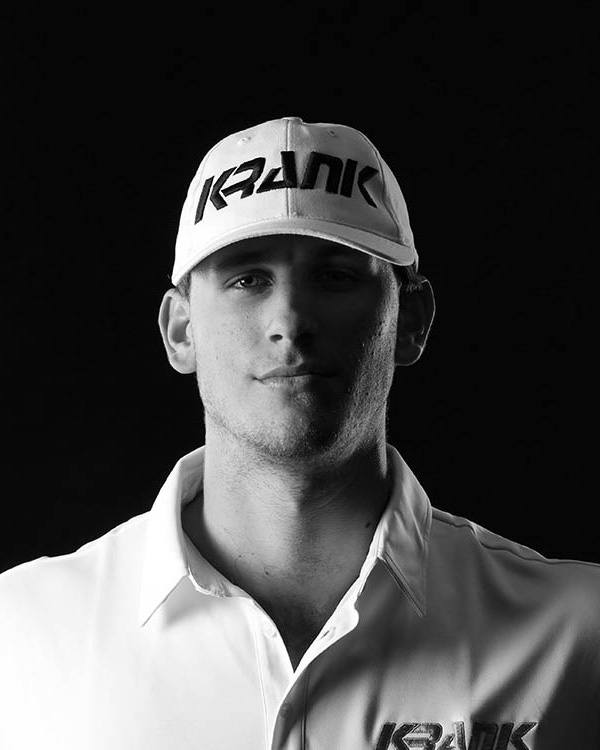 A man wearing a hat with the word krank on it
