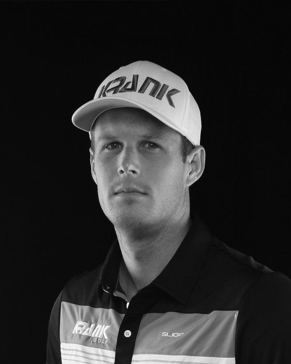 A man wearing a baseball cap with the word rank on it