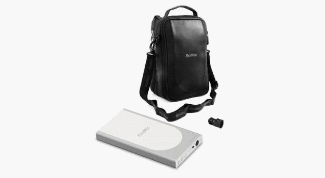 Silver device and black carrying case with strap, possibly electronics.