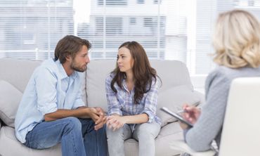 Couple sitting apart representing relationship difficulties, couples counselling blog by Patricia Lyon, south side Glasgow