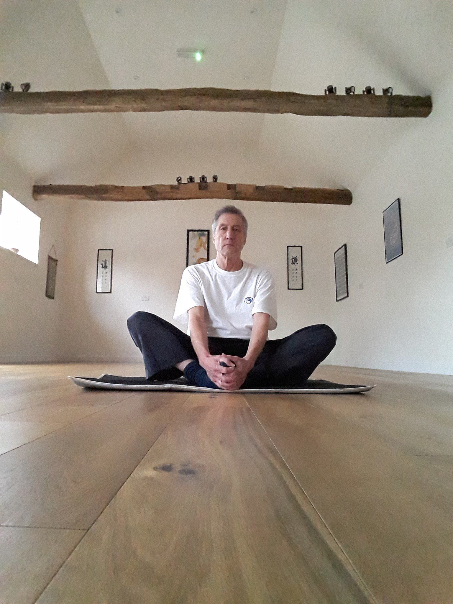 The Balanced Path At The Tai Chi Studio instructor doing sit down position with both legs crossed