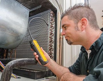 HVAC Technician with Leak Detector — HVAC Repairs in Somerville, NJ HVAC Technician with Leak Detector — HVAC Repairs in Somerville, NJ