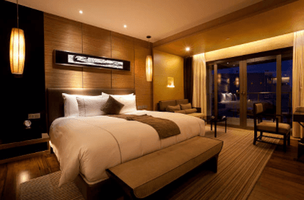 There is a large bed in the middle of the room.