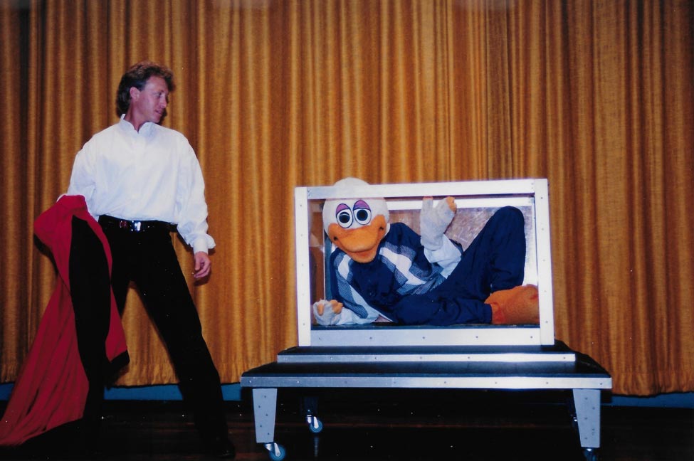 Joe Romano performing in a school assembly