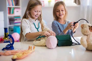 little girls playing with their toys