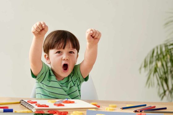 Little boy playing at a table little boy playing at a table