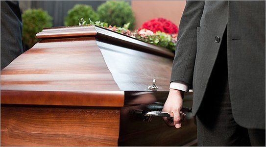 For help writing the obituary, call 0141 424 0300 Pall bearers carrying a coffin
