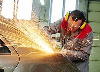 mechanic grinding car body – Maintenance in Maryville, MO mechanic grinding car body – Maintenance in Maryville, MO