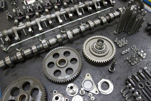 A Bunch of Metal Parts Are Laying on a Table — Rite Price Tyres In Berkeley Vale, NSW 