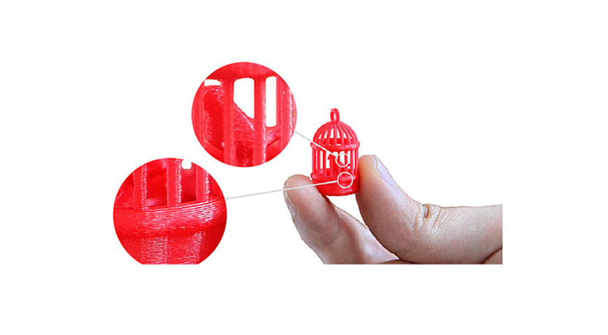 FInger holding a red color small cage and highlighted the fine feature area