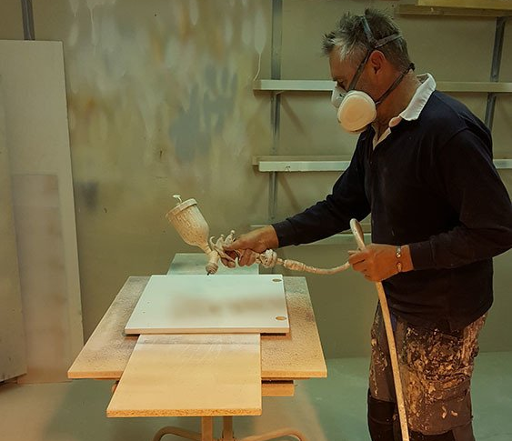 person working, spray painting, carpentry