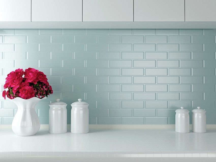 Nice wall tiled decorated with in front of flower vase