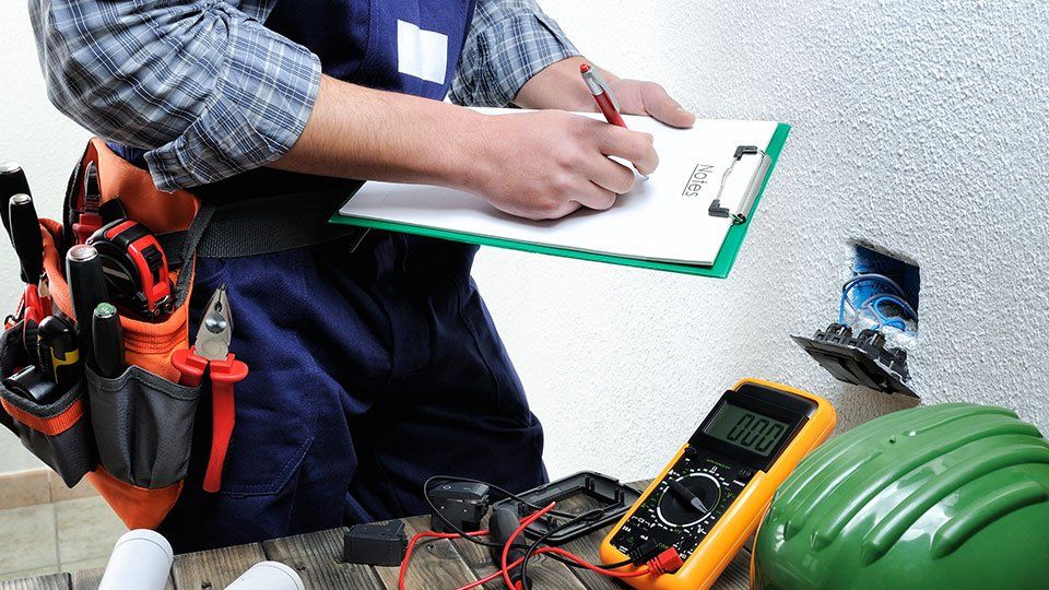 Service Electrical — Worker Writing in Stevens, WA