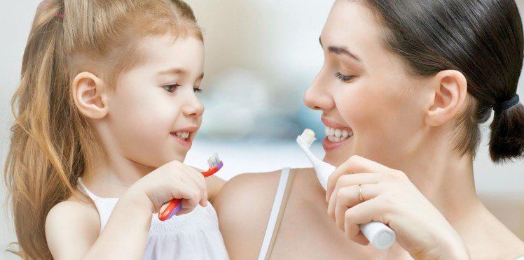 Women cleaning teeth
