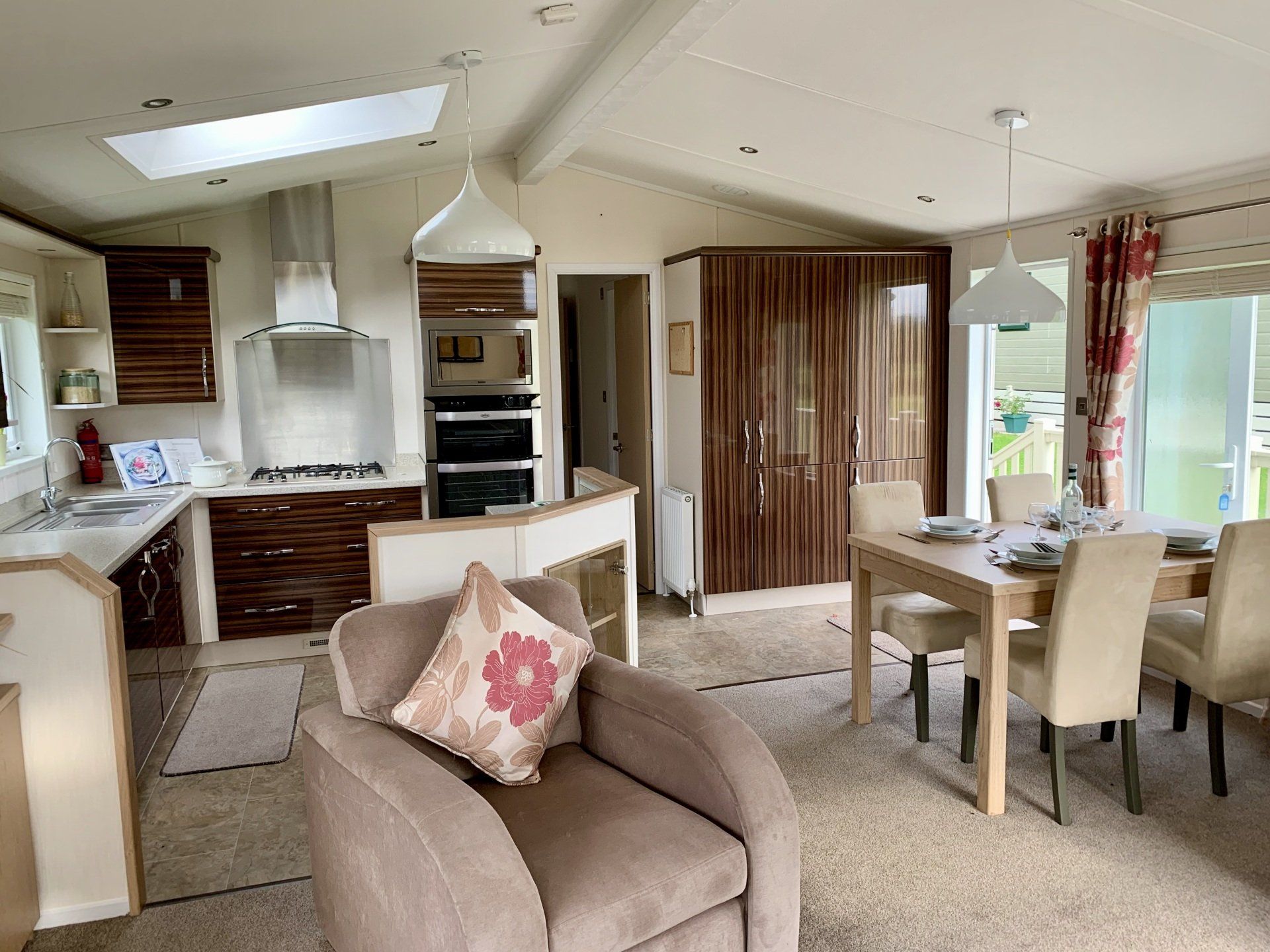 A living room with a chair , table and chairs.