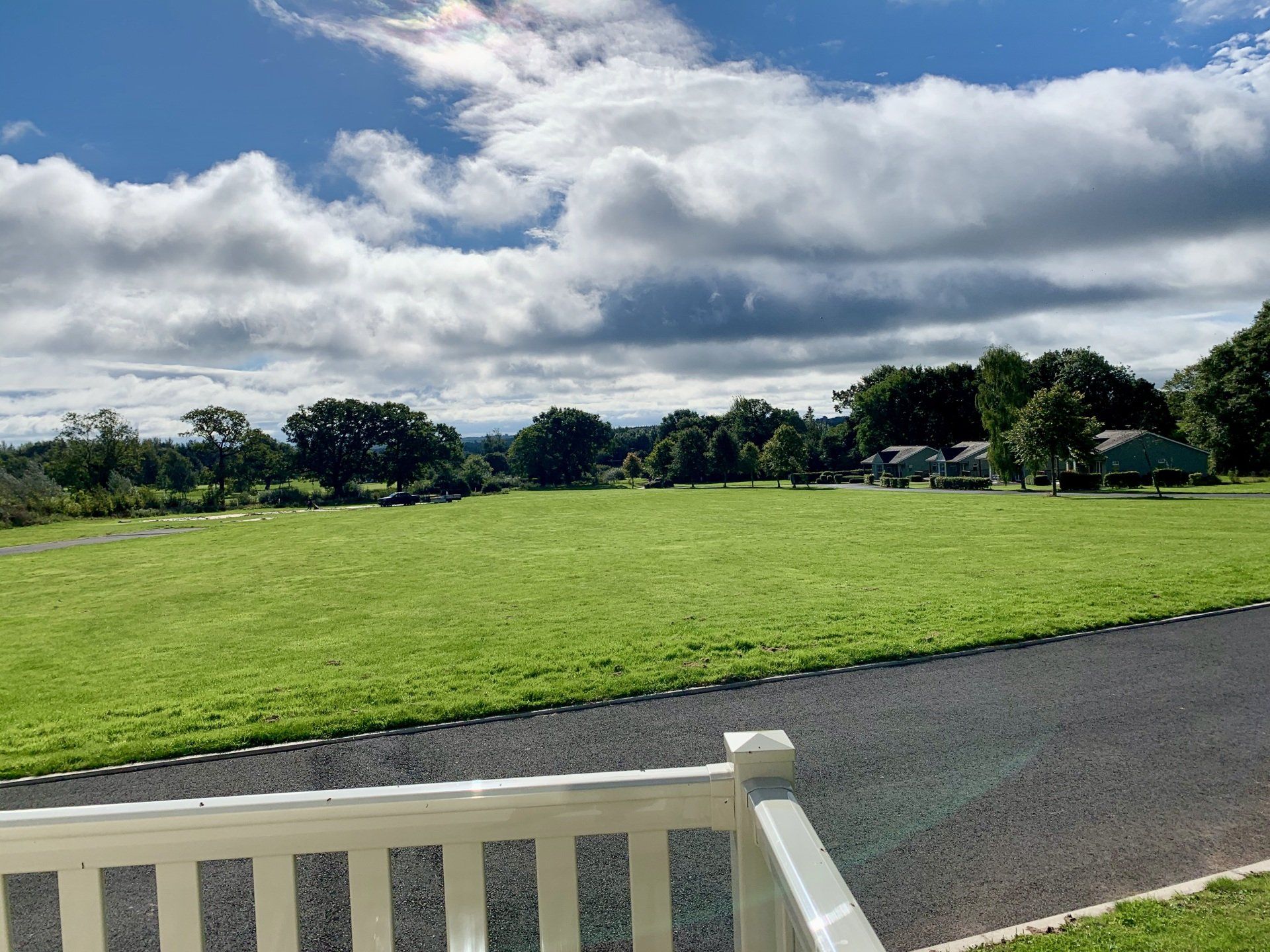 A view of a grassy field from a balcony.