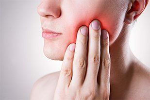 Man with a toothache. Pain in the human body—Established Dentistry Center in Fountain Valley, California Man with a toothache. Pain in the human body—Established Dentistry Center in Fountain Valley, California
