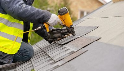 Roof Contractor Working — Springfield, MA — D.P. Carney Construction, Inc. Roof Contractor Working — Springfield, MA — D.P. Carney Construction, Inc.