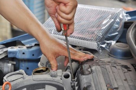 Car Mechanic working—auto repair services in Oldsmar, FL Car Mechanic working—auto repair services in Oldsmar, FL