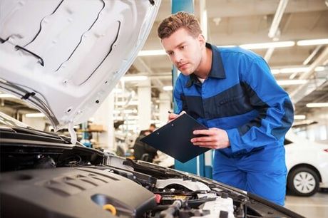 Mechanic on work—auto repair services in Oldsmar, FL Mechanic on work—auto repair services in Oldsmar, FL
