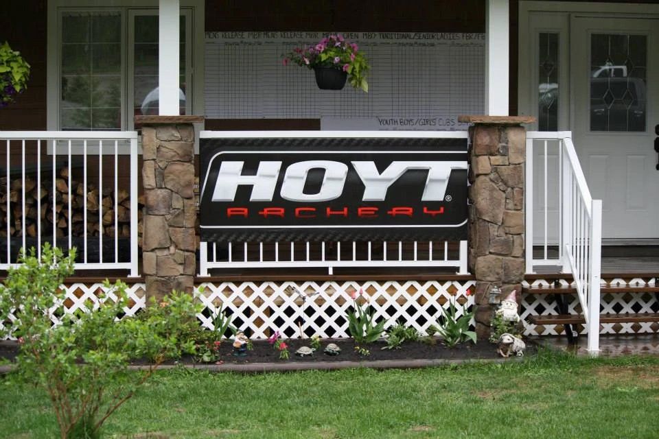 A hoyt logo is on the side of a house