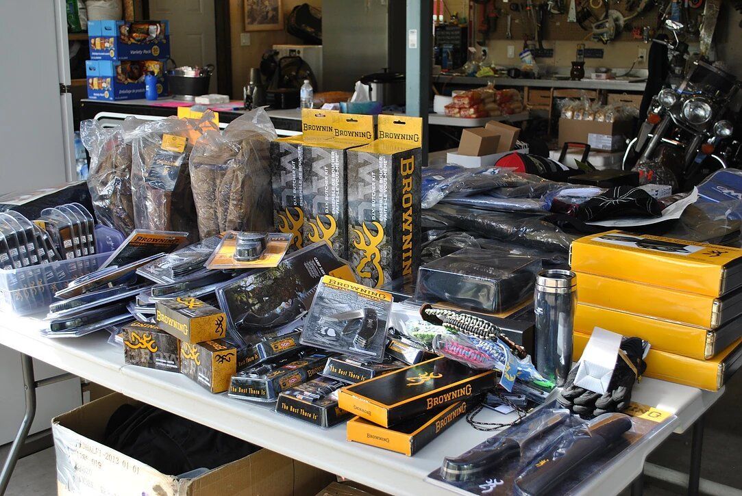 A table filled with lots of motorcycle parts and boxes