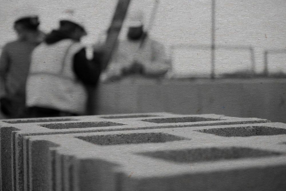construction worker and blocks black and white