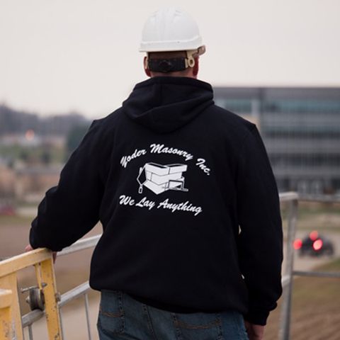 guy in sweater with logo