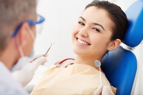 Dentist and Smiling Patient at Clinic — Urbana, IL — J. Barry Howell DDS Dentist and Smiling Patient at Clinic — Urbana, IL — J. Barry Howell DDS