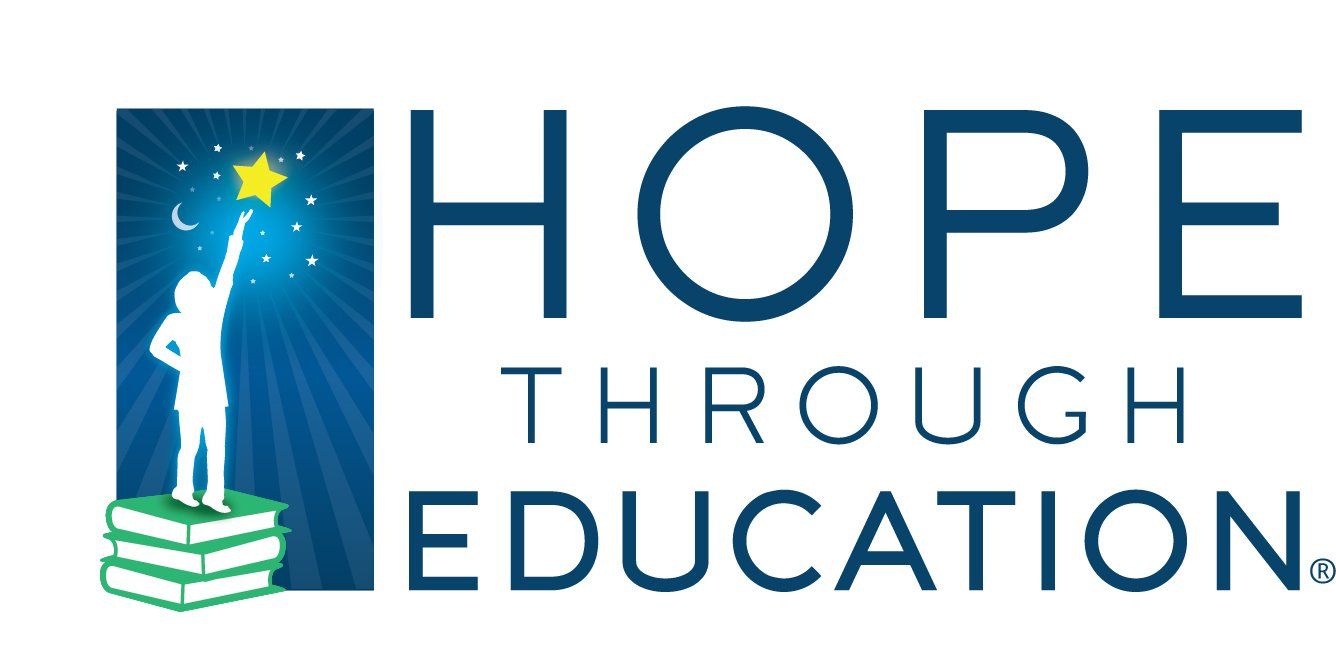 Logo: Silhouette reaching for star over books, 