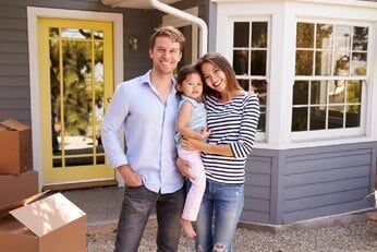 happy family in front of their home — Insurance Agents in South New Jersey happy family in front of their home — Insurance Agents in South New Jersey