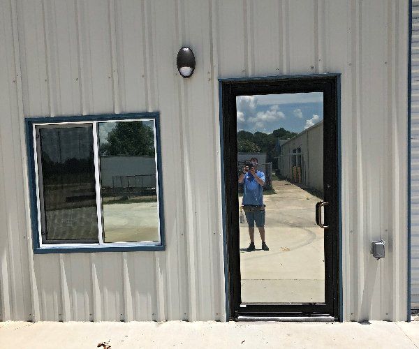 Residential Tint Blue Ridge — Man Reflection on the Door in Montgomery, AL