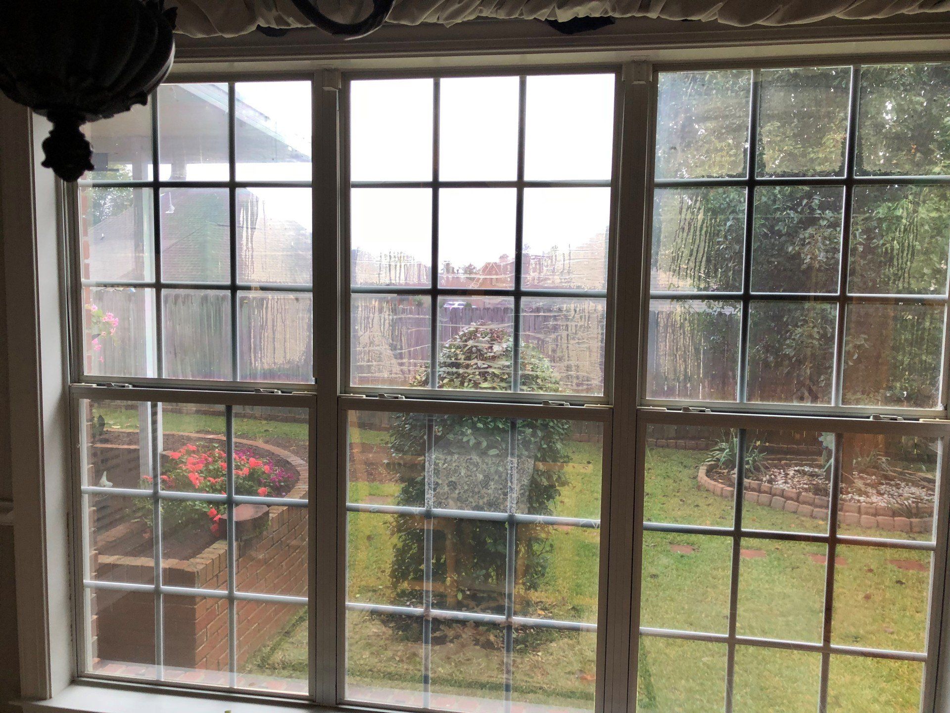 Bad view out home windows before old tint was removed in Prattville, AL