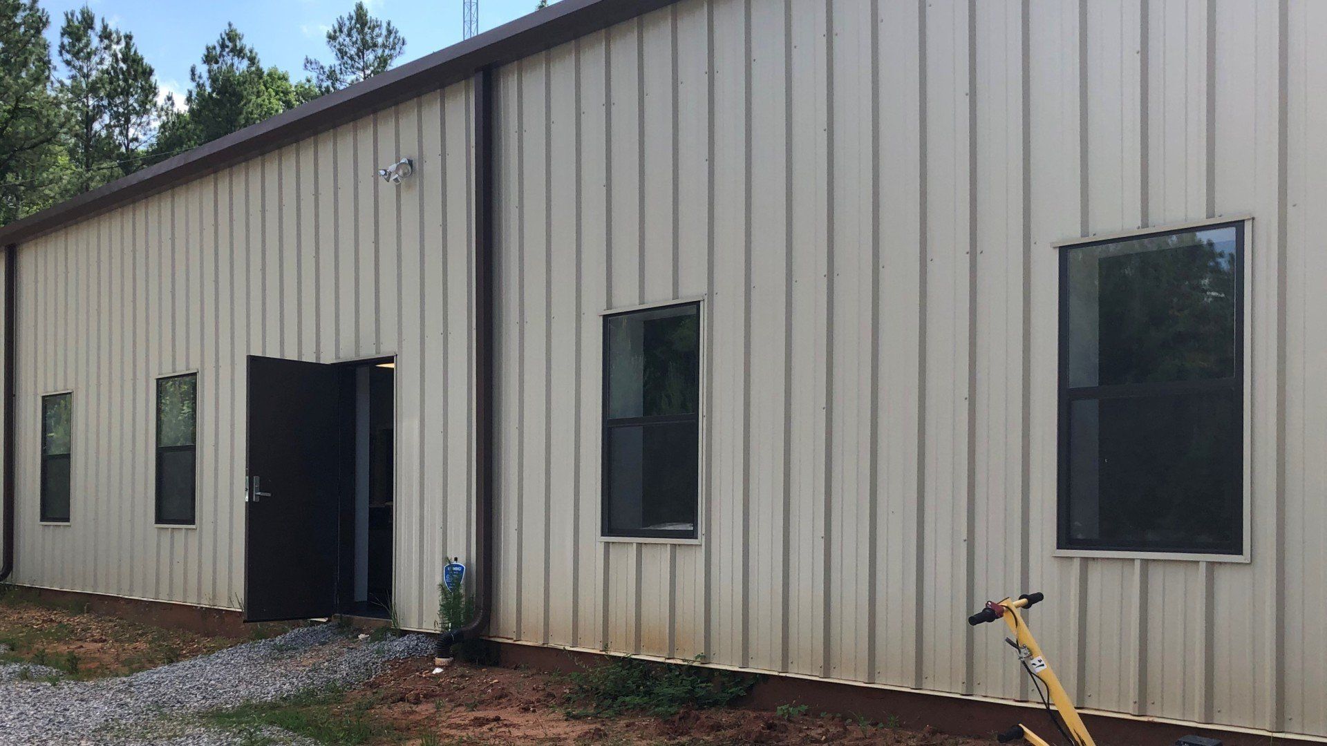 Office windows before Professional Tint installation in Valley Grande, AL