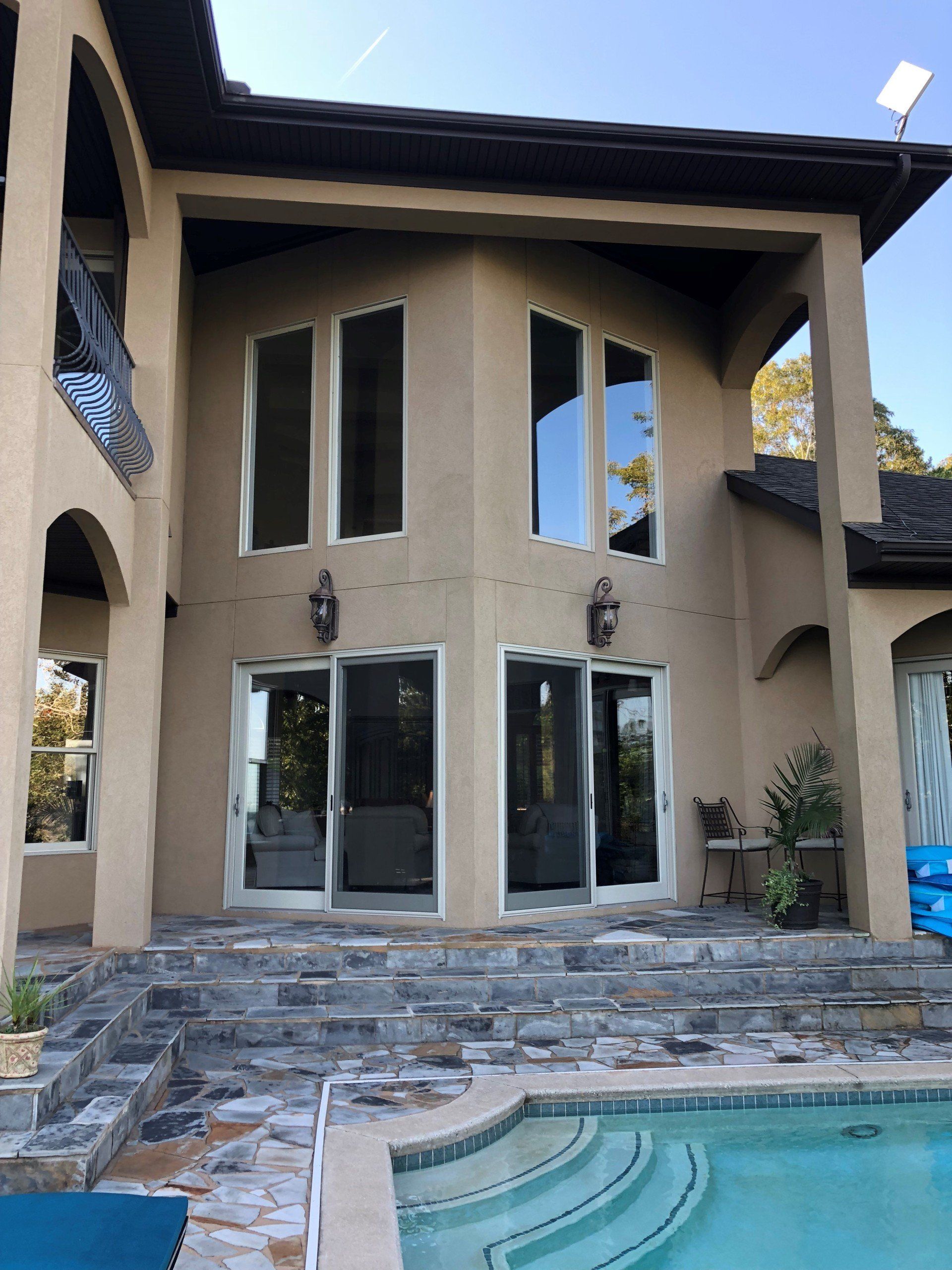 Residential glass windows being tinted to stop sun fade
