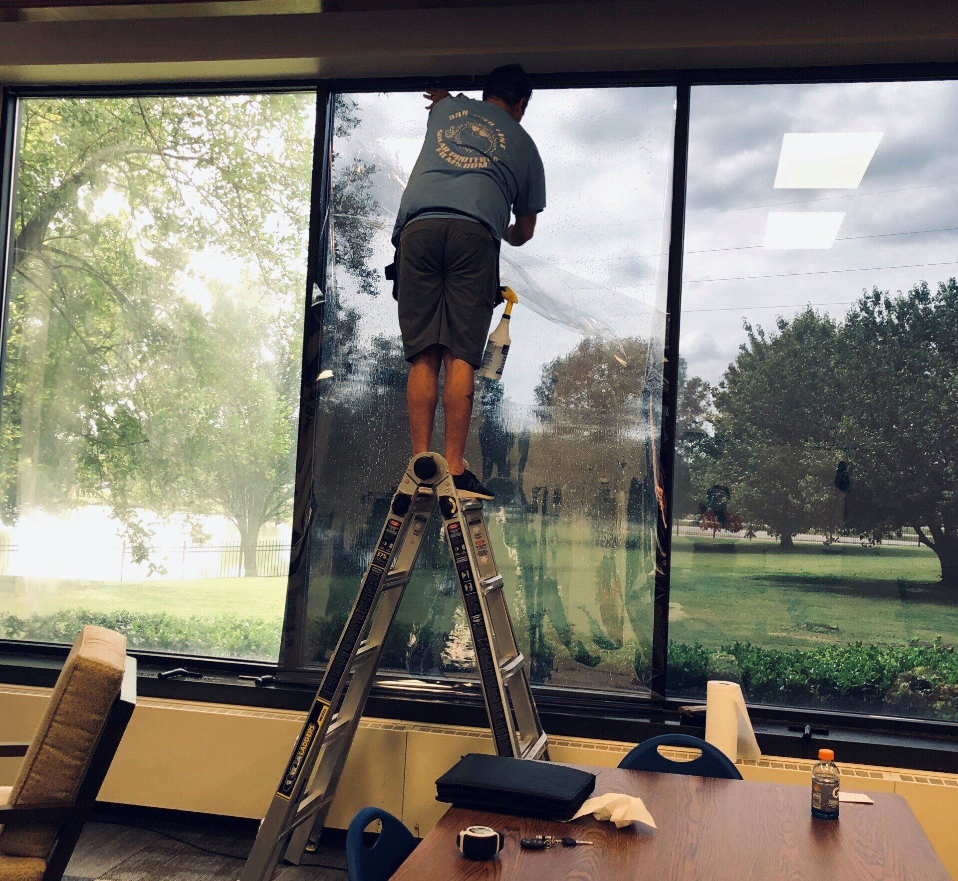 Business tinting - During SPF Tint Installation. Bright Glare Contrast seen on Left (untinted) window.