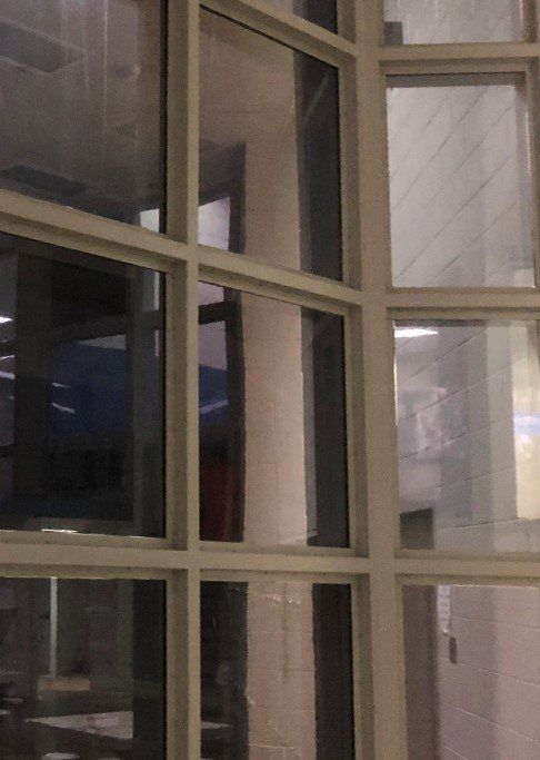 Visible side of glass tinted for 1-way mirror effect - window tinting at jail in Alabama