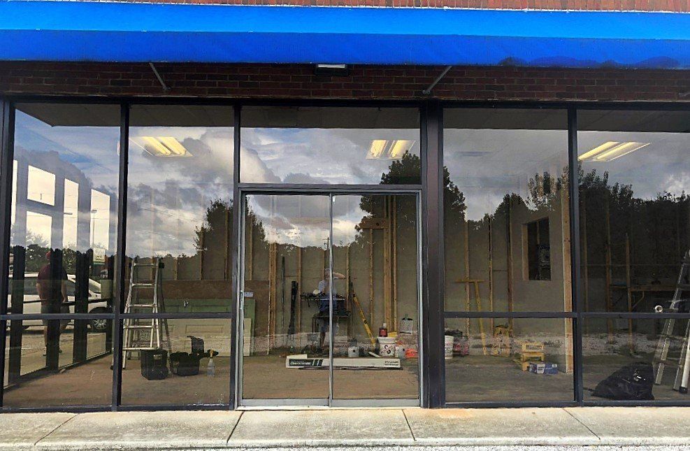 Saints and sinners tattoo parlor seen before tint installation in Auburn, AL on 9/27/2018